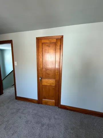 an aerial view of a house with a lake view