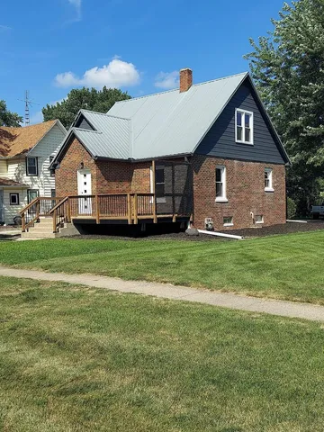a house with trees in the background
