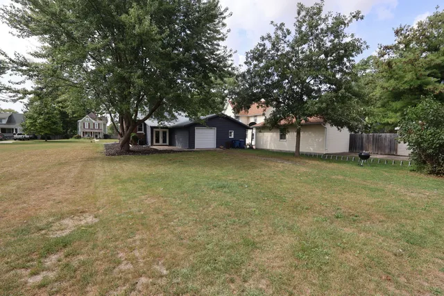 a view of a livingroom with furniture and windows