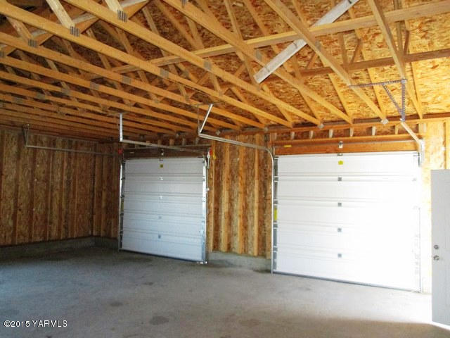173401 West Johnson Road Grandview, WA 98930 - Photo 4 of 38 a view of a room with wooden walls