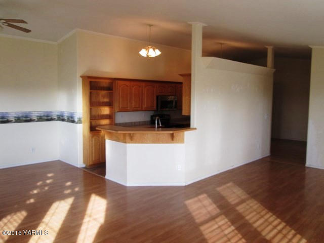 173401 West Johnson Road Grandview, WA 98930 - Photo 33 of 38 a view of kitchen with microwave and cabinets