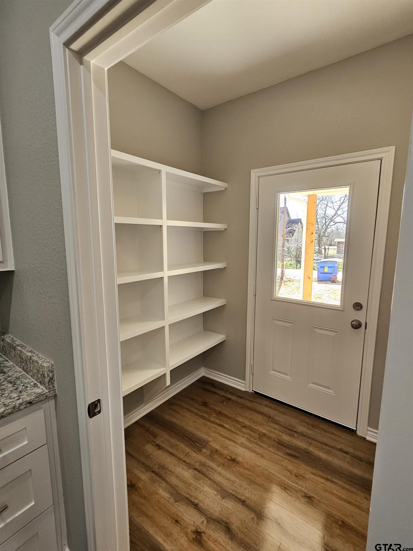 100 Cook Street, Unit 3 Arp, TX 75750 - Photo 3 of 7 a room with walk in closet and a window