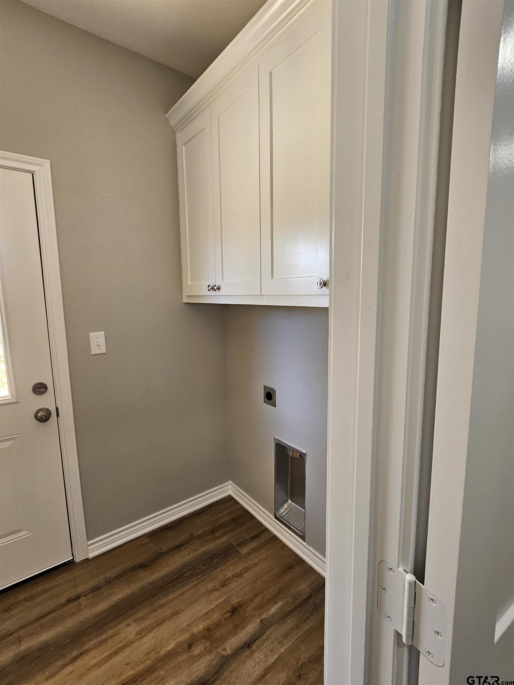100 Cook Street, Unit 3 Arp, TX 75750 - Photo 4 of 7 a view of empty room with wooden floor