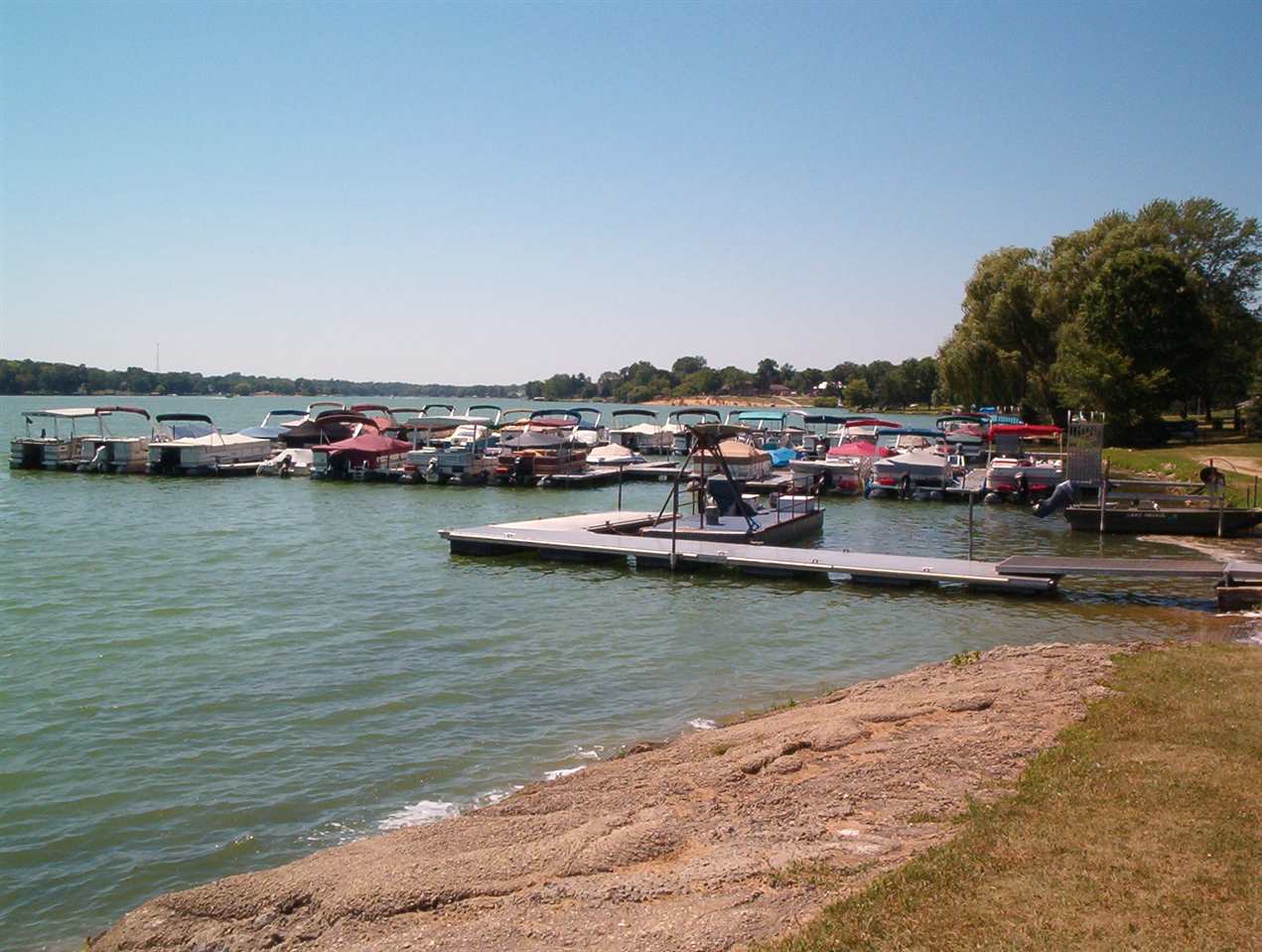 2064 Hillsdown Road Lake Summerset, IL 61019 - Photo 12 of 20 a view of a lake with boats and trees in the background