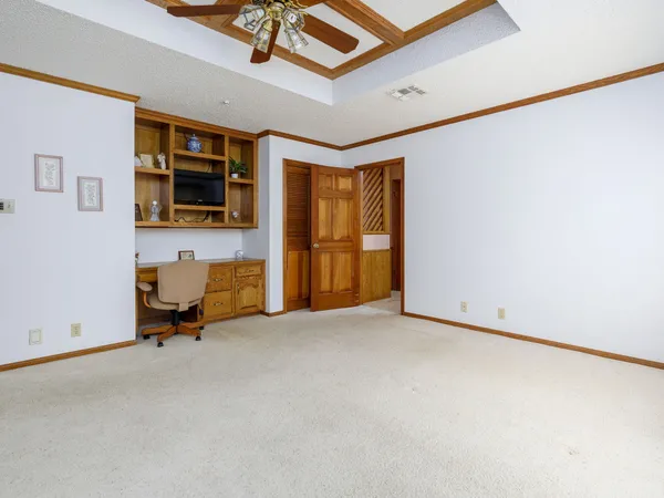 a view of a livingroom with furniture and a window