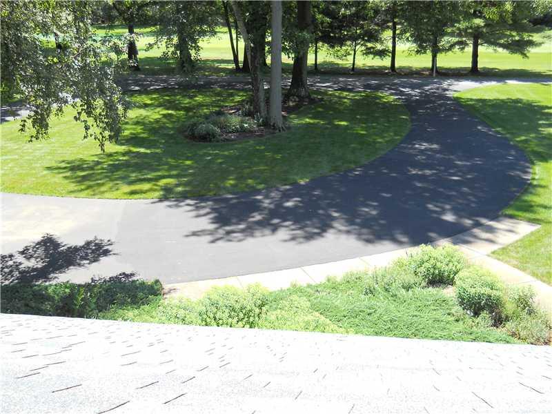 427 A Three Degree Road Butler, PA 16002 - Photo 22 of 25 Exterior Front. Rooftop view of front yard and circular driveway, also a raceway/training ground for young cyclists.