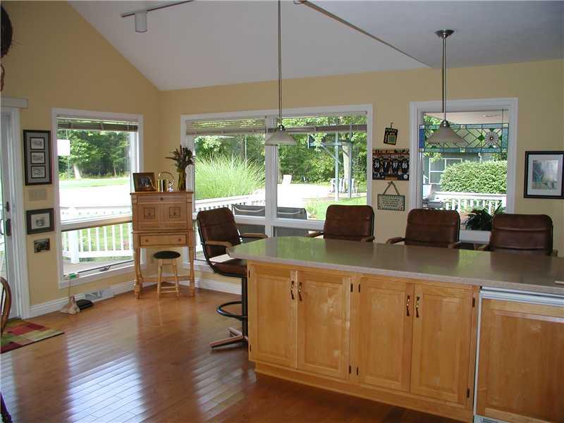 427 A Three Degree Road Butler, PA 16002 - Photo 8 of 25 Family Room. Sliding glass door opens to deck. Peninsula counter comfortably seats four. Cabinets custom made for glassware and bottle storage, Also, a below counter refrigerator and a bar sink. Watch deer and other wildlife. Hardwood floor is ash with beveled edges