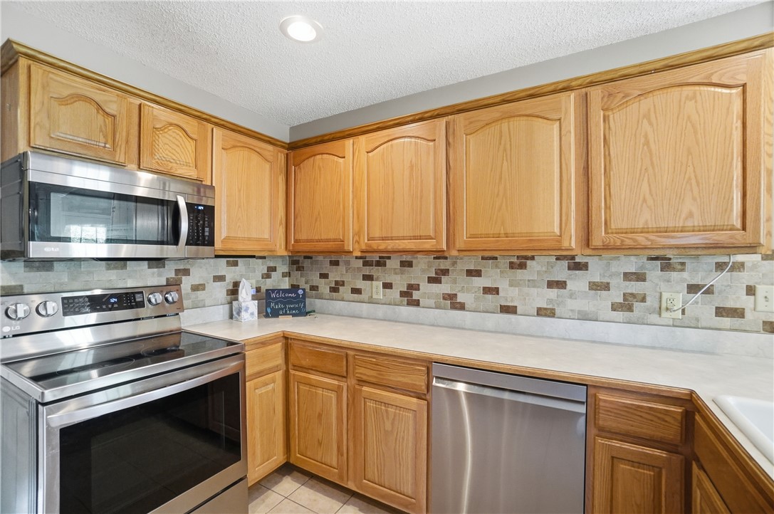 1208 Jarva Lane Springboro, OH 45066 - Photo 25 of 75 This kitchen boasts beautiful cabinetry and modern appliances, perfect for culinary endeavors.