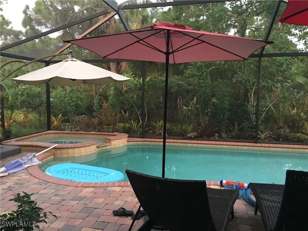 a view of a swimming pool with a patio