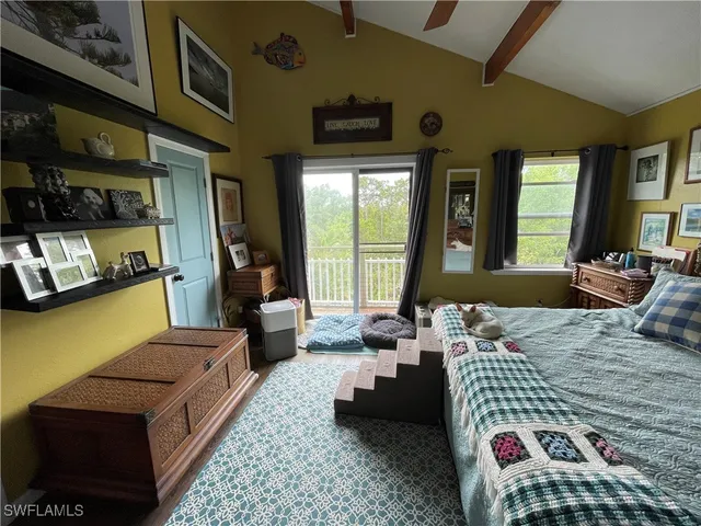 a bathroom with a toilet and a shower curtain