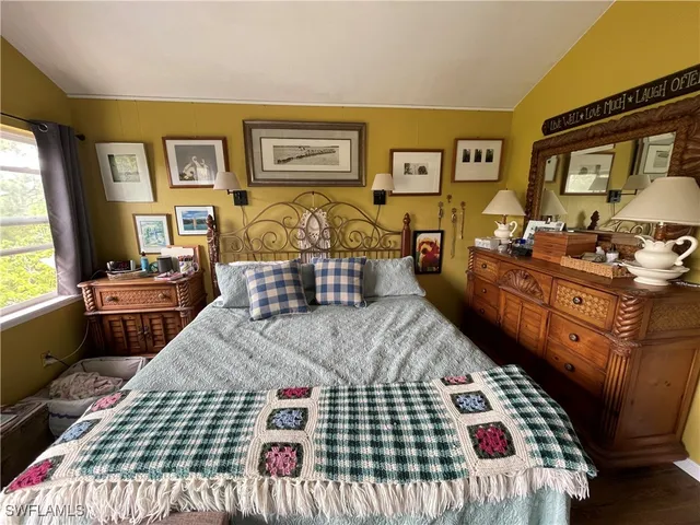 a bathroom with a sink a mirror a toilet and vanity