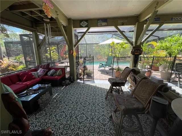 a view of a chair and table in the garden