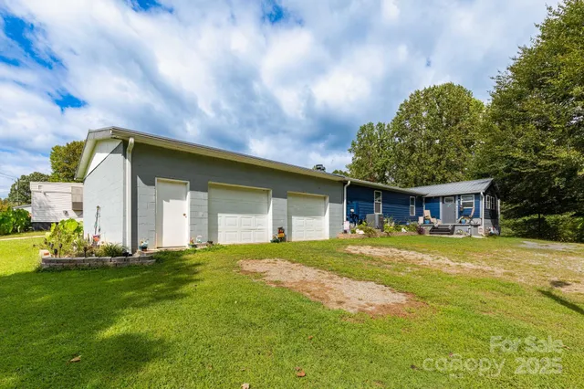 a front view of house with yard and trees