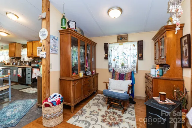 a living room with furniture rug and a chandelier