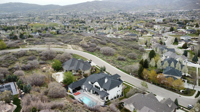 614 East High Lane Alpine, UT 84004 - Photo 25 of 75 Aerial view of property and surrounding area with a mountainous background and nearby suburban area
