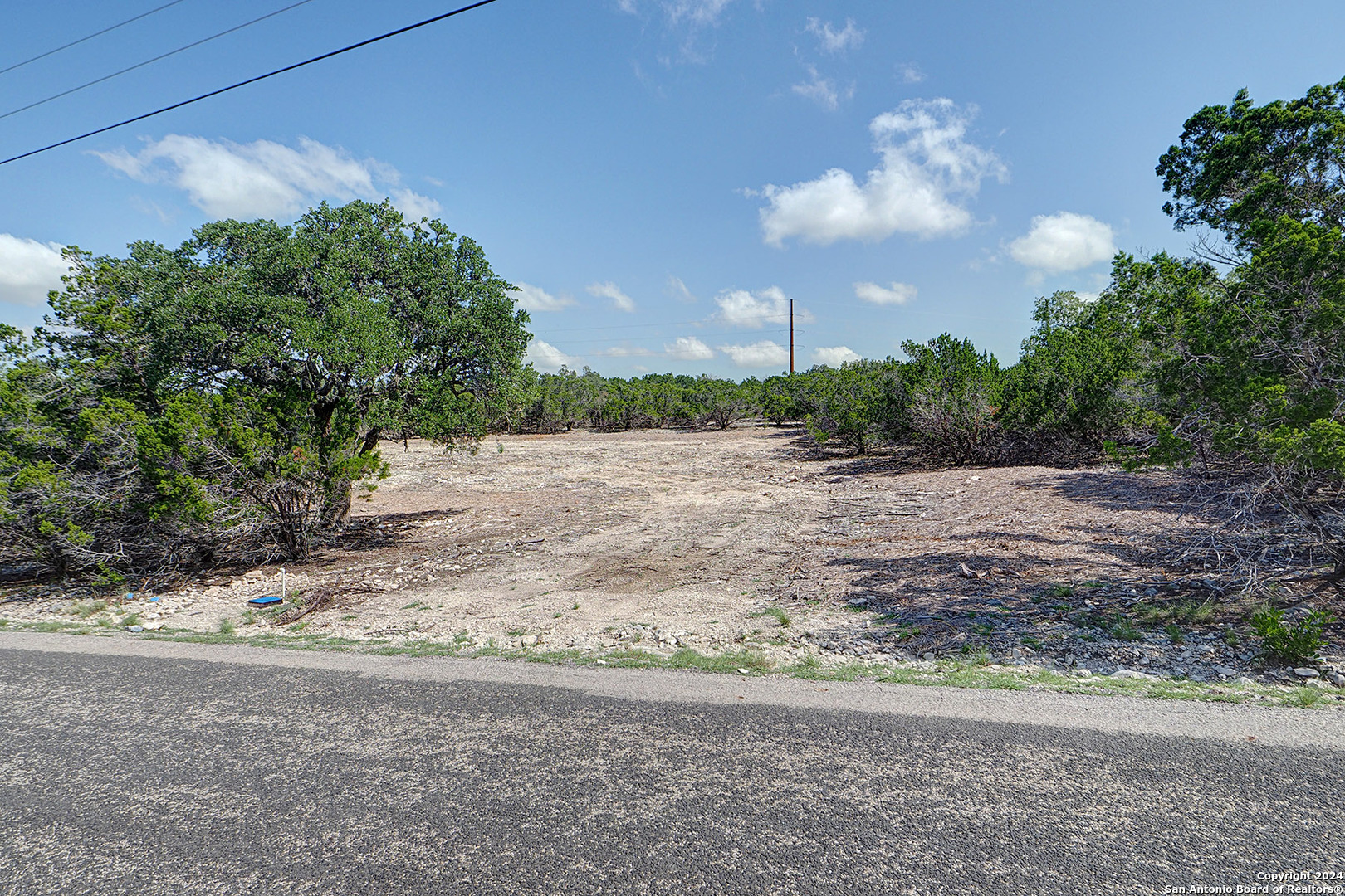 570 Ranch Rim Drive West Ingram, TX 78025 - Photo 13 of 15 a view of a field with trees in background