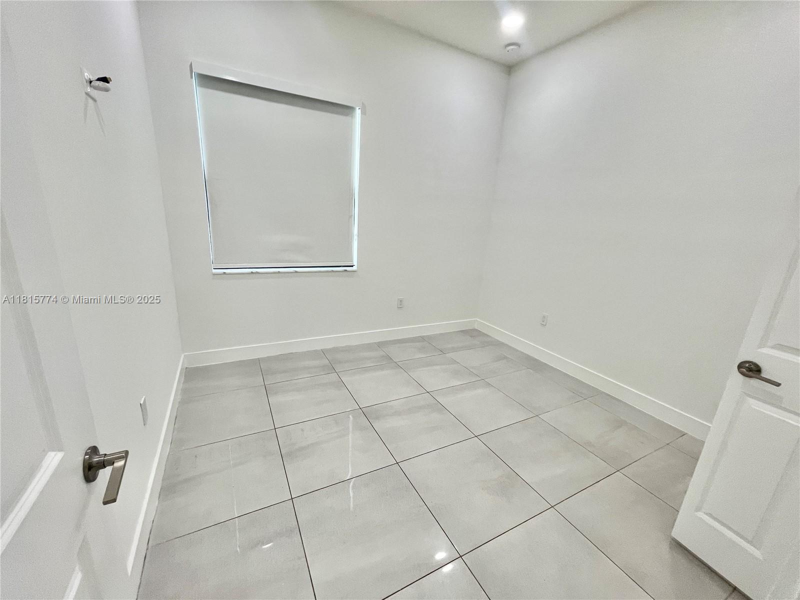17324 Southwest 41st Street, Unit 17324 Miramar, FL 33029 - Photo 16 of 30 a view of a room with white tiles