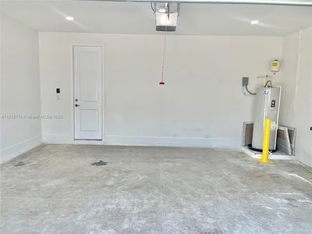 a large kitchen with a stove a sink and a refrigerator