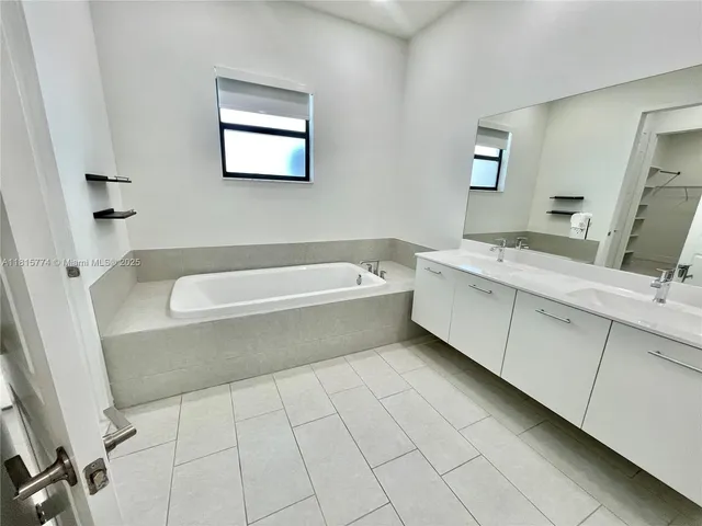 a bathroom with a bathtub sink and toilet