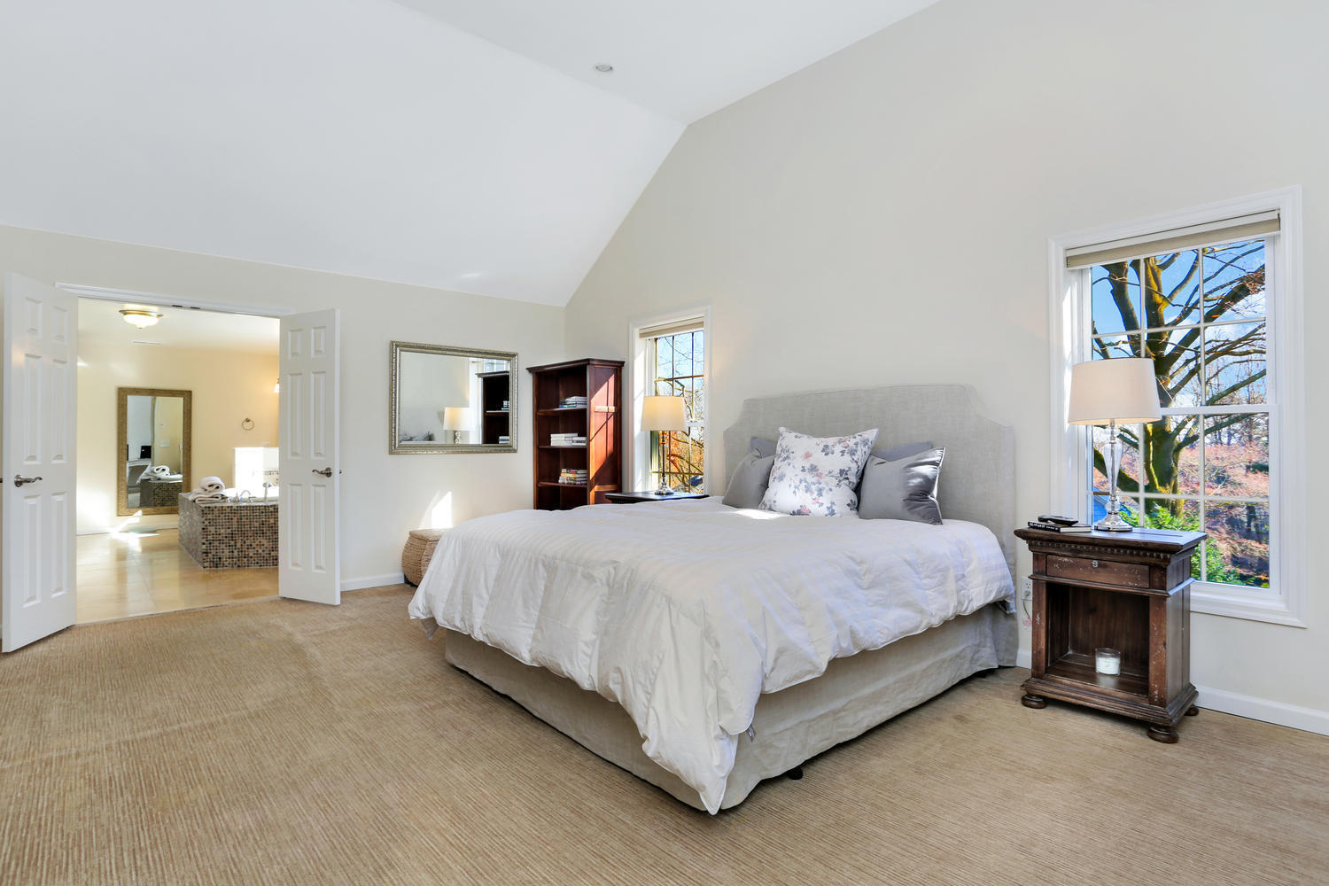 19 Walmsley Road Darien, CT 06820 - Photo 16 of 30 a spacious bedroom with a bed and a chandelier