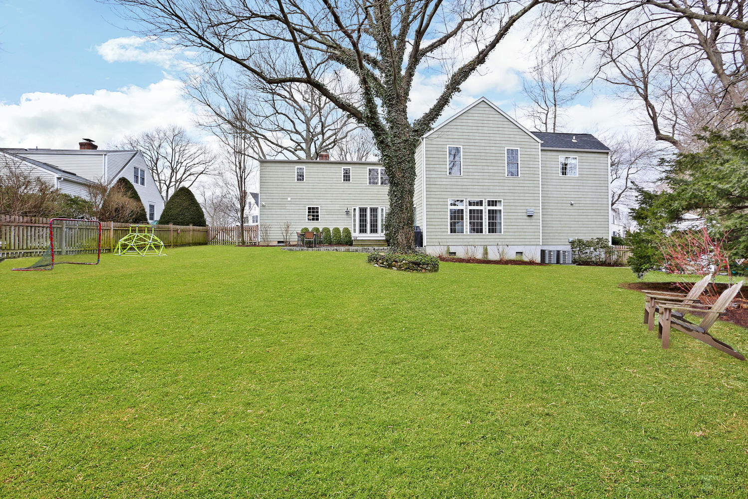 19 Walmsley Road Darien, CT 06820 - Photo 29 of 30 a view of a house with a yard and sitting area