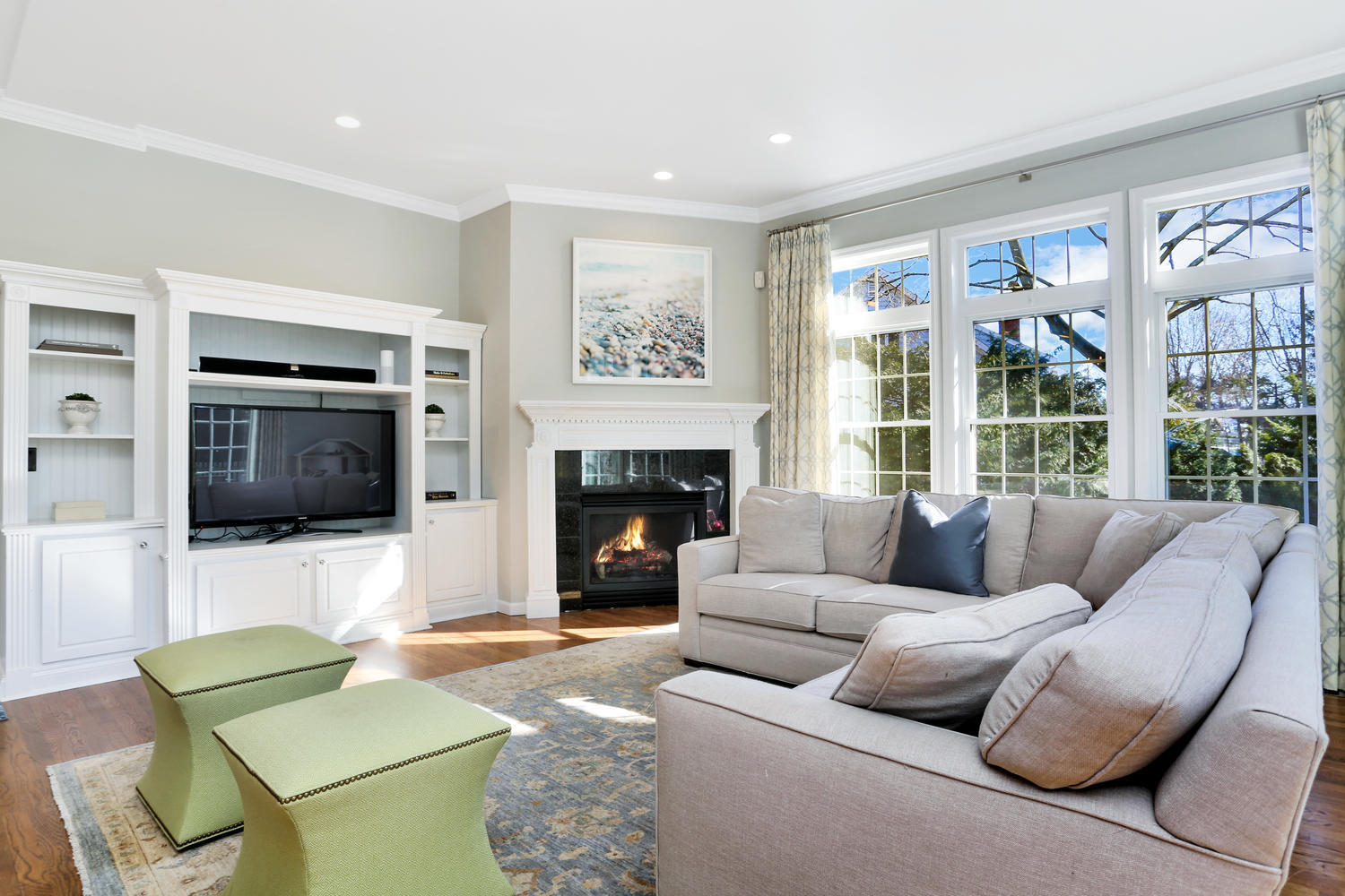 19 Walmsley Road Darien, CT 06820 - Photo 9 of 30 a living room with furniture a flat screen tv and a fireplace