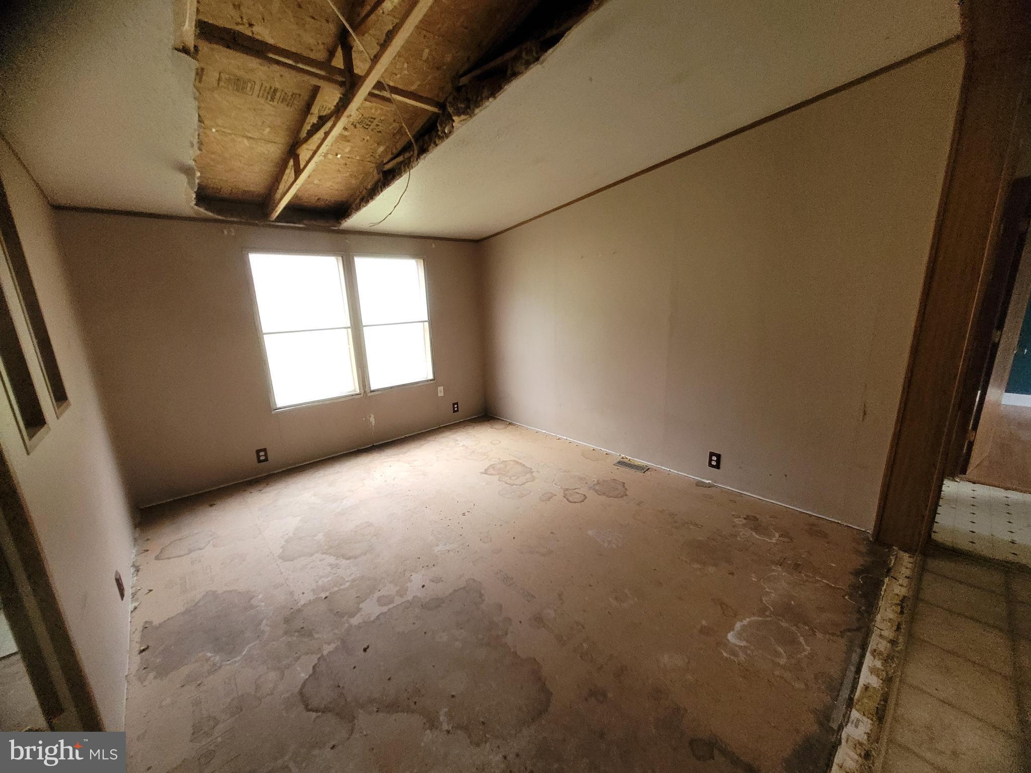 13518 Blank Road Northwest Mount Savage, MD 21545 - Photo 8 of 36 a view of empty room with windows