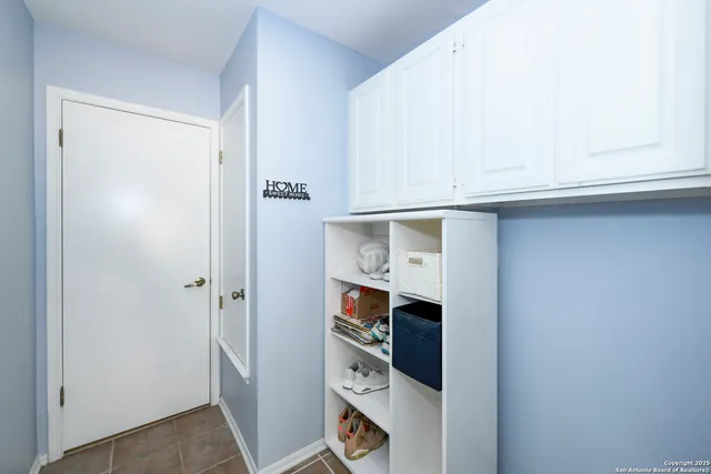 a kitchen with stainless steel appliances a refrigerator and a window