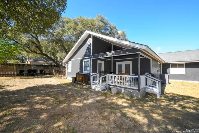 a view of a house with a yard covered in snow