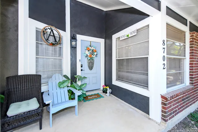 a view of livingroom with furniture and a potted plant