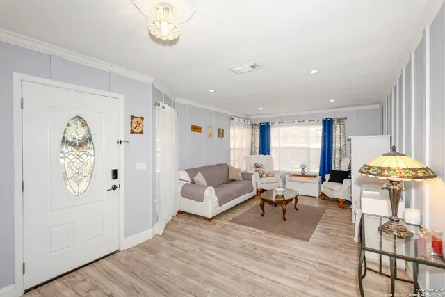 a living room with furniture and a table