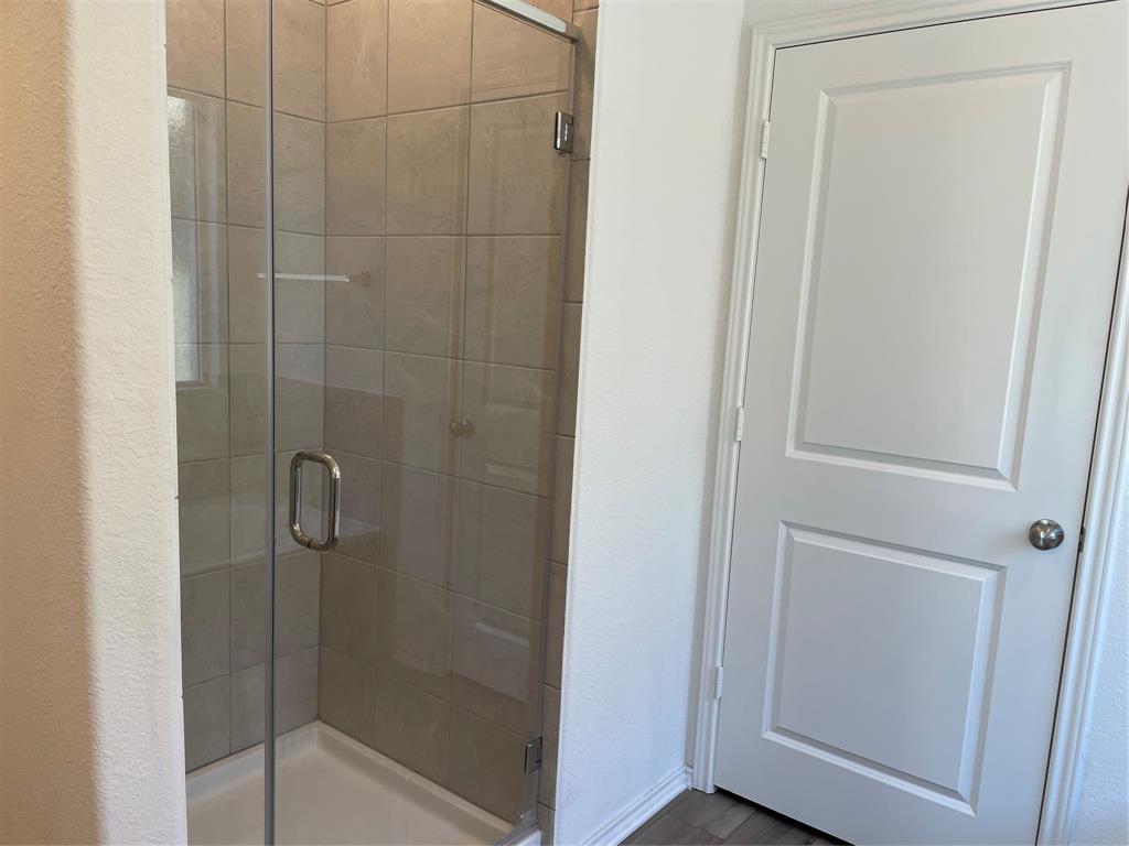 129 Starflower Cove Georgetown, TX 78628 - Photo 15 of 31 Bathroom with a stall shower