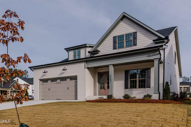 a kitchen with kitchen island granite countertop a sink cabinets and wooden floor