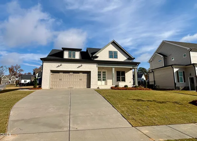 a view of wooden floor and windows in an empty room