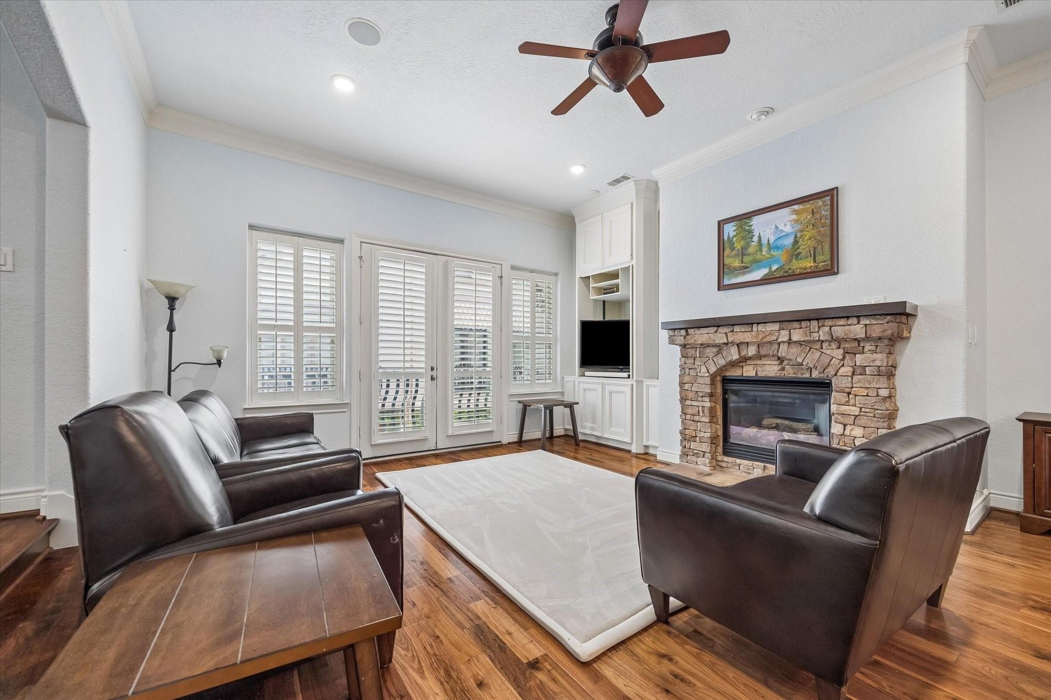 2128 Harold Street, Unit A Houston, TX 77098 - Photo 4 of 14 a living room with furniture a window and a fireplace