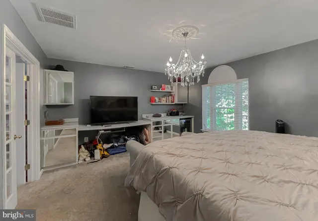 a bathroom with a sink a toilet and a shower