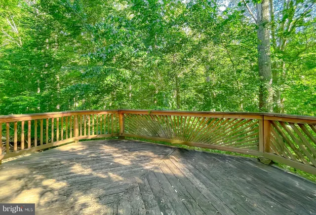 a view of a swimming pool with an outdoor space and seating area