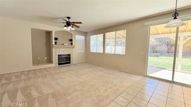 a view of a hallway with bathroom and a sink
