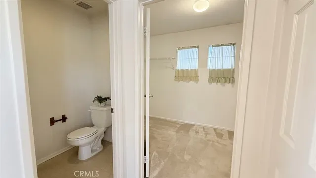 a view of a yard with a house and a large tree