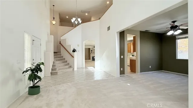 a view of an empty room with stairs