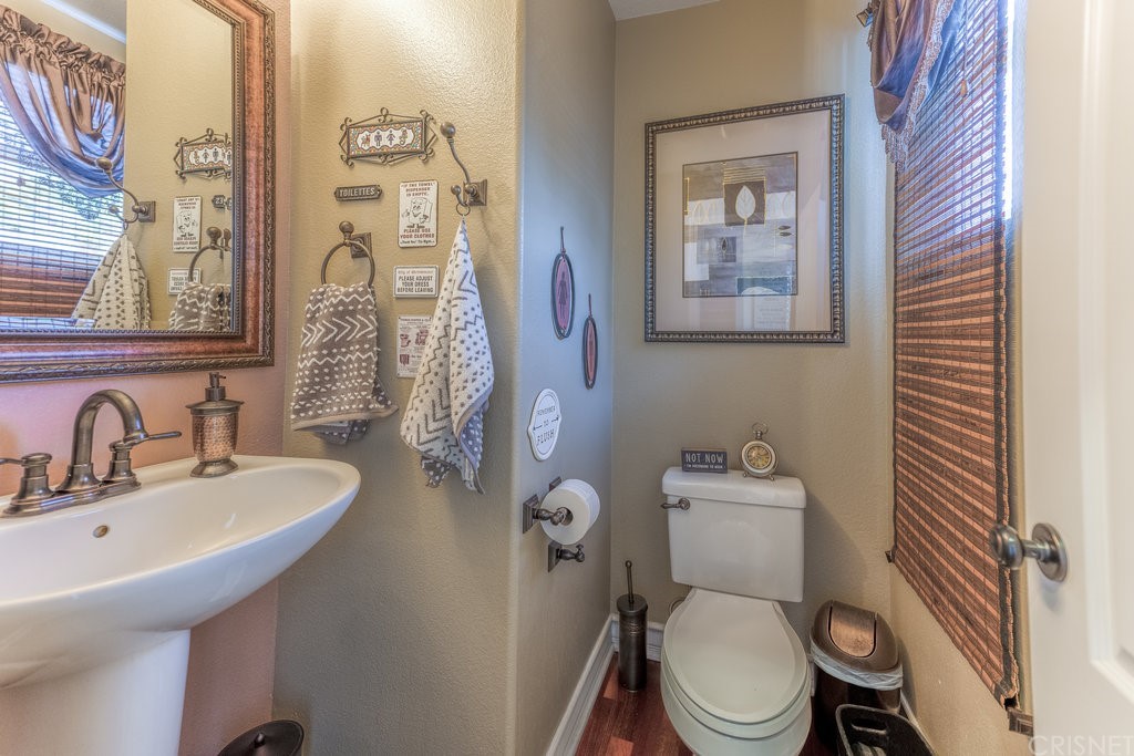29021 Mirada Circulo Valencia, CA 91354 - Photo 18 of 57 a bathroom with a toilet sink and mirror