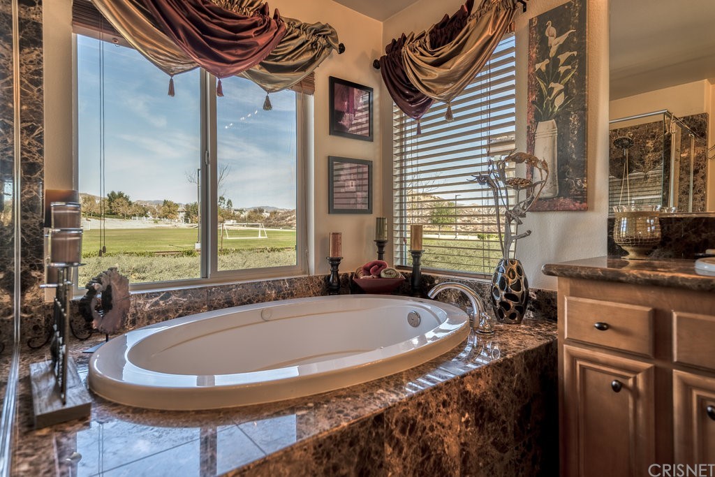 29021 Mirada Circulo Valencia, CA 91354 - Photo 29 of 57 a bath tub sitting next to a window
