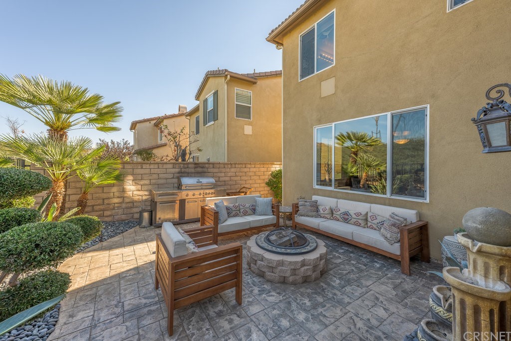 29021 Mirada Circulo Valencia, CA 91354 - Photo 40 of 57 a outdoor space with the couches and a potted plant