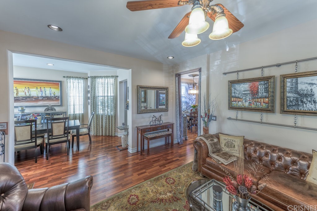 29021 Mirada Circulo Valencia, CA 91354 - Photo 5 of 57 a living room with furniture a dining table and a fireplace