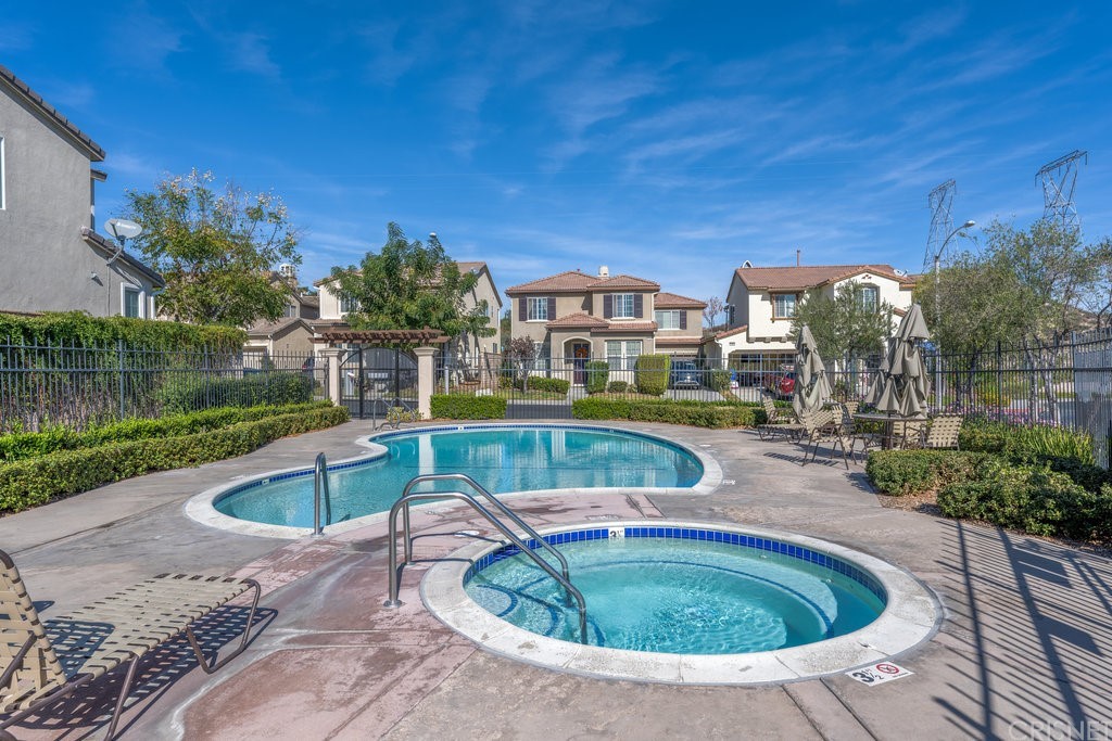 29021 Mirada Circulo Valencia, CA 91354 - Photo 43 of 57 a view of a swimming pool with a patio