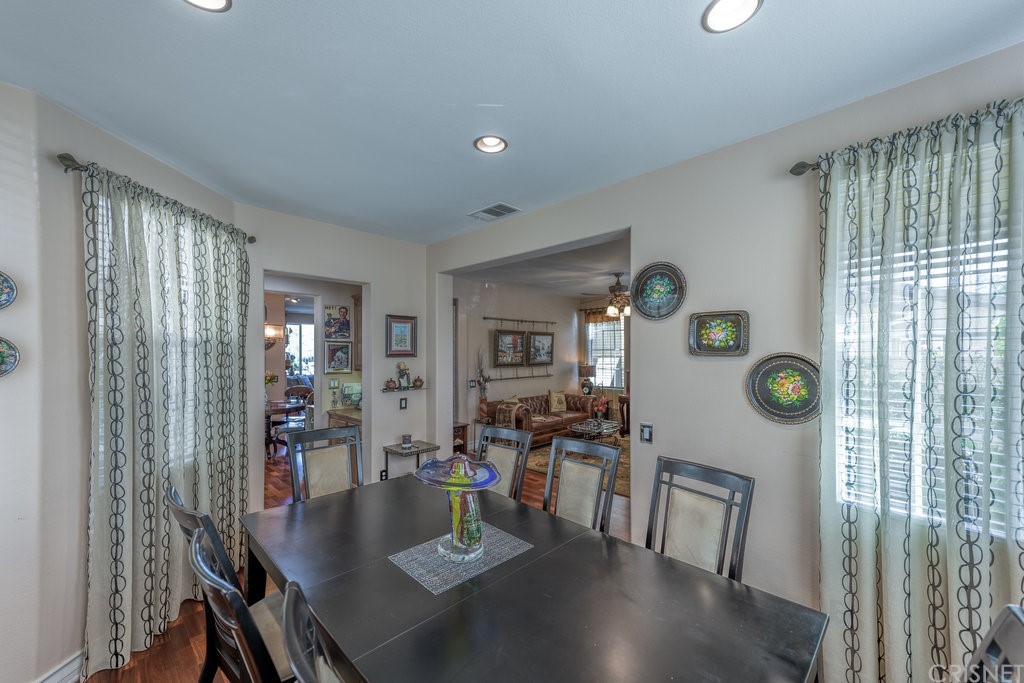 29021 Mirada Circulo Valencia, CA 91354 - Photo 7 of 57 a view of a dining room with furniture and chandelier