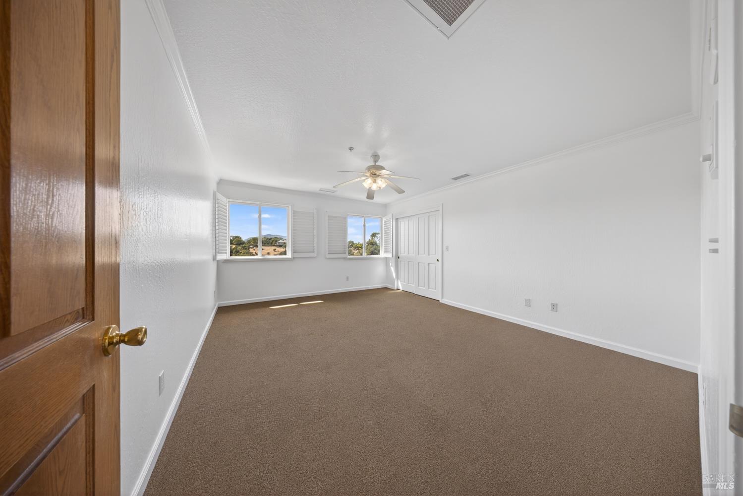 10 Lockton Lane Novato, CA 94945 - Photo 37 of 68 Unstaged upper-level bedroom with generous proportions and flexibility for a guest room, child's room, workout room, sewing room, etc. Full of light, gorgeous views.