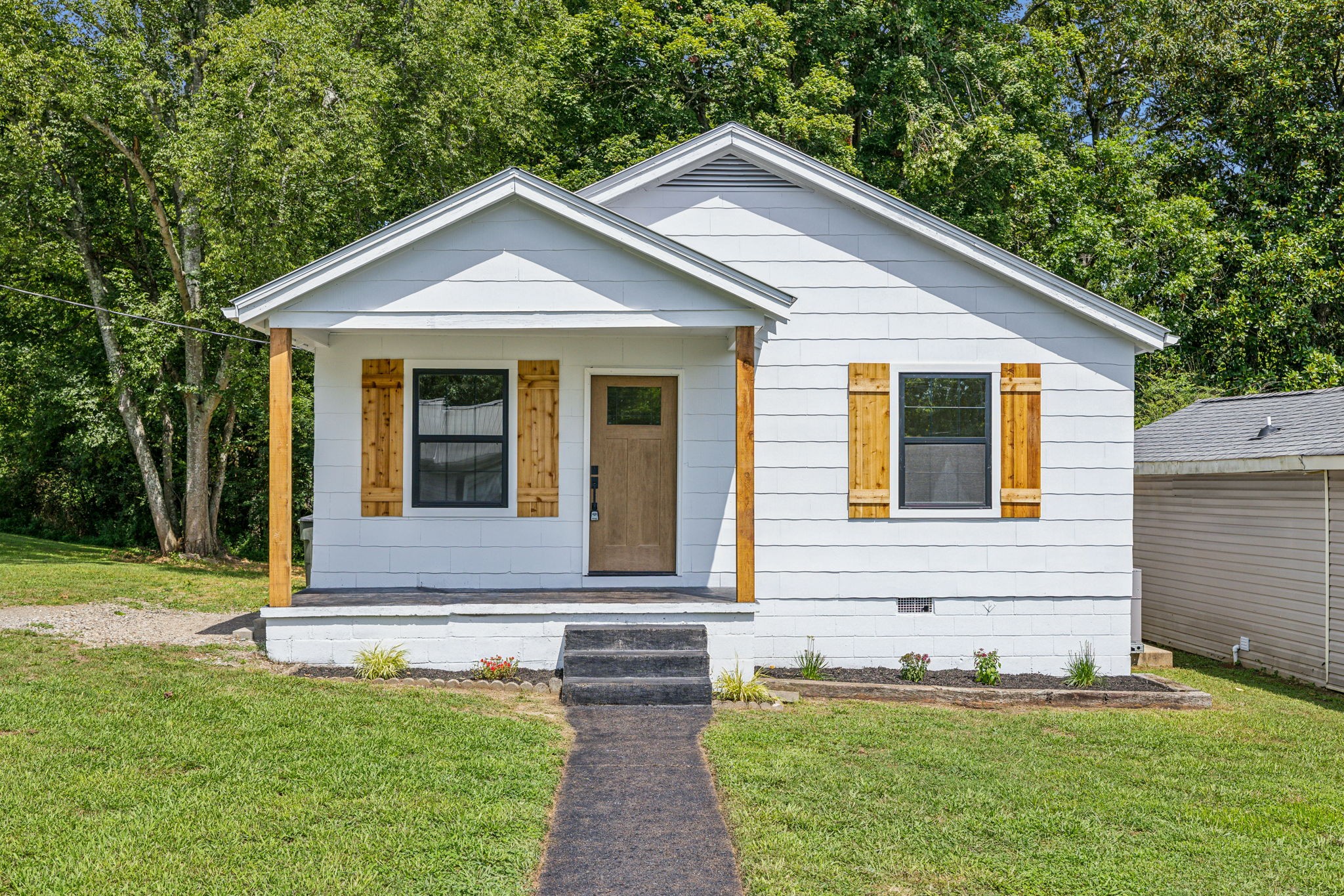 111 Riverside Drive Centerville, TN 37033 - Photo 1 of 27 Adorable cottage that has been COMPLETELY remodeled! Move-in ready with new walls, ceilings, windows, floors, all new kitchen and bathroom! Sits proudly on a shady, treed lot in Centerville.