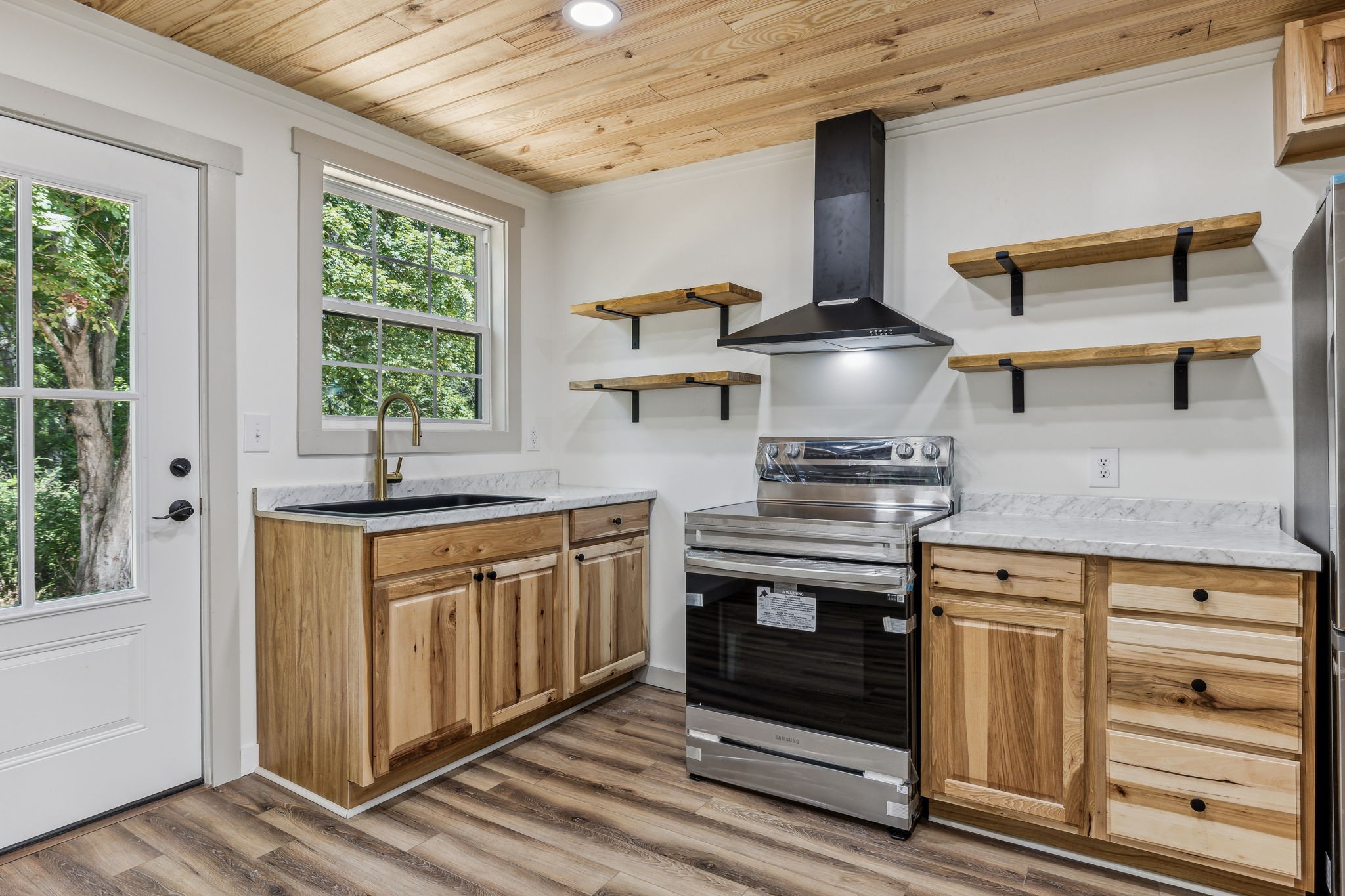 111 Riverside Drive Centerville, TN 37033 - Photo 14 of 27 Open shelving and new kitchen cabinets complete the look!