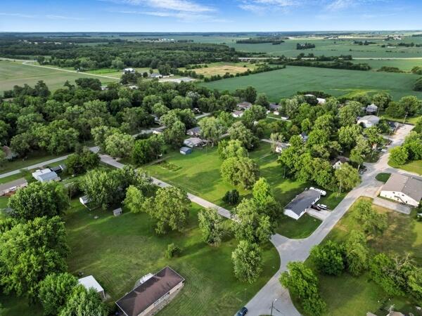419 Clay Street Morocco, IN 47963 - Photo 12 of 15 an aerial view of green landscape with trees houses and mountain view